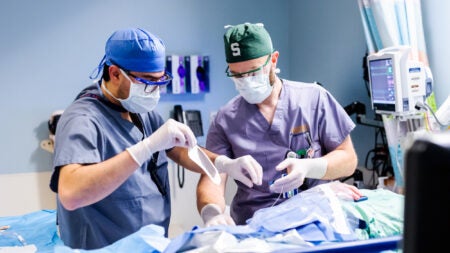 University of Virginia Dr. Paul DeMarco instructs a resident during a regional anesthesia procedure.