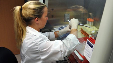 UVA CPHG Scientist working in lab